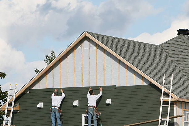 Professional Siding Replacement technician working in Brentwood, NY
